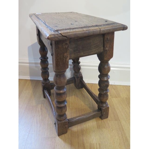 85 - An 18th century oak joint stool on turned supports - height 48cm x 41cm x 25cm