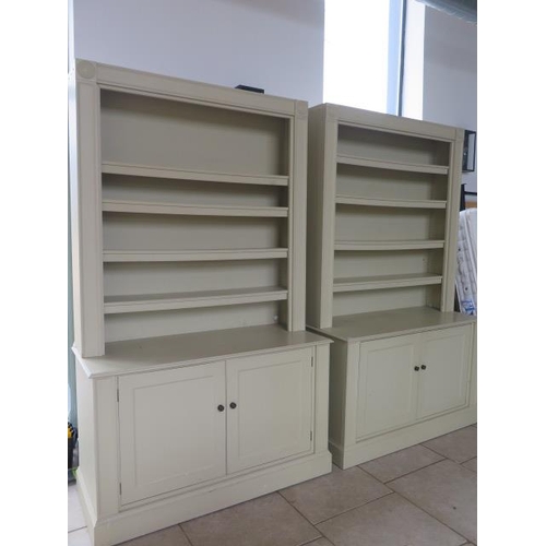 13 - A pair of handmade country house painted bookcase cabinets, each with an adjustable shelved top abov... 