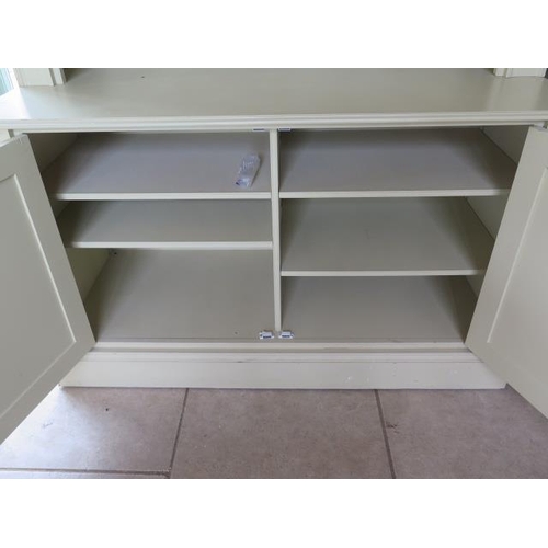 13 - A pair of handmade country house painted bookcase cabinets, each with an adjustable shelved top abov... 