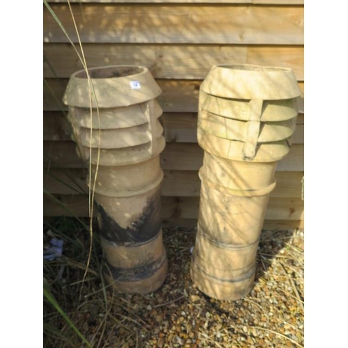 14 - A pair of Doulton Lambeth stoneware chimney pots, 92cm tall, cracking to top of one but generally go... 