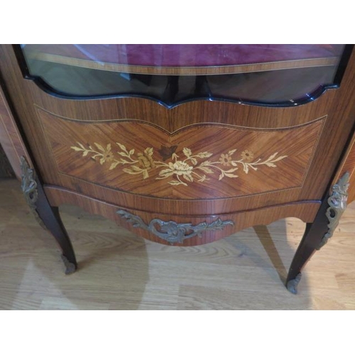58 - A pair of 20th century marquetry inlaid vitrine display cabinets with bow glass panels and ormolu mo... 
