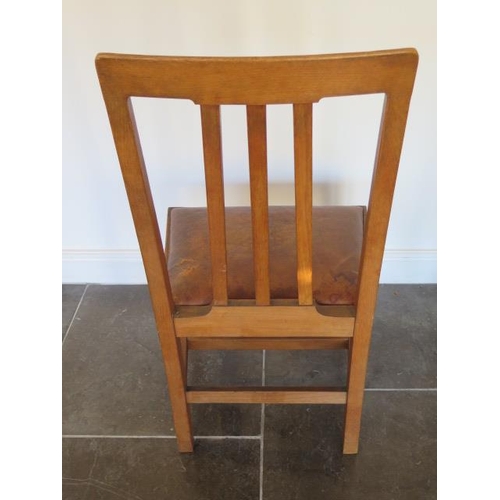 61 - A set of eighteen 20th century dining chairs with leather seat pads, removed from a Cambridge Univer... 