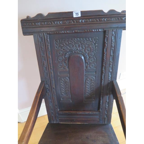 73 - A carved oak wainscot type armchair, 100cm tall x 51cm wide x 56cm deep, some old worm and restorati... 