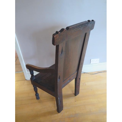 73 - A carved oak wainscot type armchair, 100cm tall x 51cm wide x 56cm deep, some old worm and restorati... 