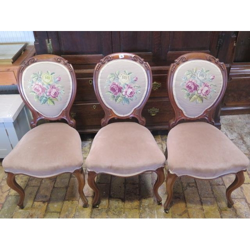 76 - A set of three Victorian balloon back chairs, one leg repaired