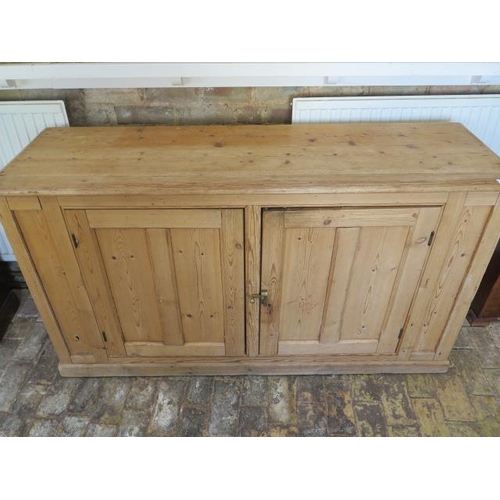 80 - A Victorian stripped pine two door cupboard, 87cm tall x 158cm x 50cm, condition consistent with age... 