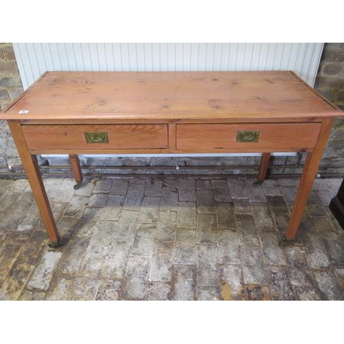 84 - A 19th century pine two drawer side table, 75cm tall x 129cm x 53cm