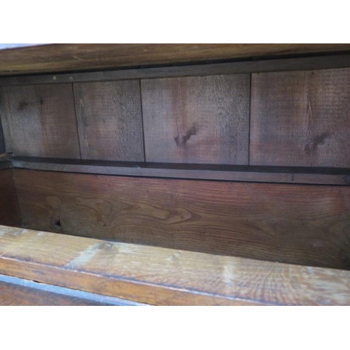 86 - A Georgian oak chest on chest with an arrangement of three small drawers above six long drawers on b... 