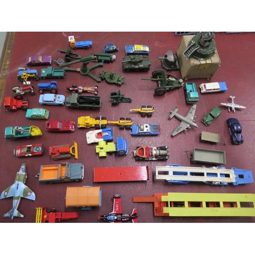 932 - A collection of assorted diecast vehicles and toys including two Dinky planes, Military Astra search... 