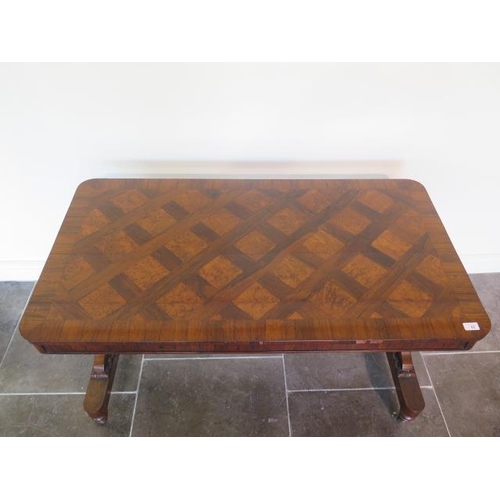 82 - A 19th century rosewood and burr walnut stretcher table on lyre end supports united by a barley twis... 