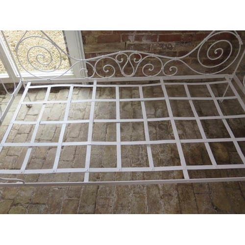 55 - A 20th century ornate wrought iron folding campaign bed, 109cm tall x 100cm wide x 188cm long, recen... 