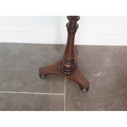 72 - An early Victorian rosewood pole screen with embroided banner in good condition, 142cm tall