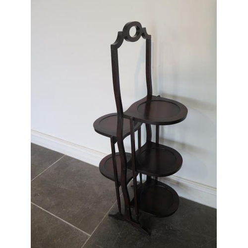 75 - A 1920-30's double sided folding cake stand in good polished condition