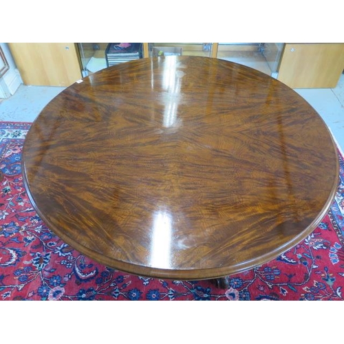 77 - A Victorian walnut tilt top breakfast / dining table on carved tripod base, 72cm tall x 133cm diamet... 