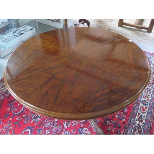 77 - A Victorian walnut tilt top breakfast / dining table on carved tripod base, 72cm tall x 133cm diamet... 