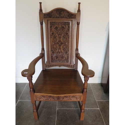 80 - A well carved oak throne armchair, 135cm tall x 73cm wide x 62cm deep