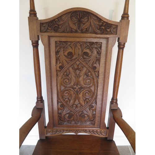 80 - A well carved oak throne armchair, 135cm tall x 73cm wide x 62cm deep