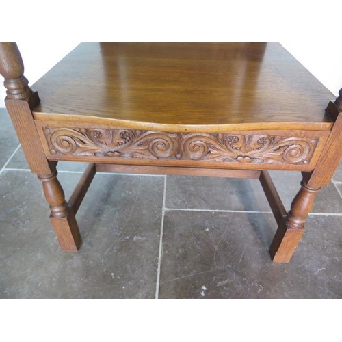 80 - A well carved oak throne armchair, 135cm tall x 73cm wide x 62cm deep