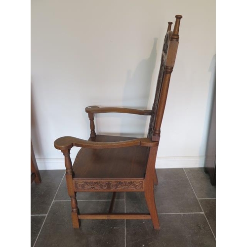 80 - A well carved oak throne armchair, 135cm tall x 73cm wide x 62cm deep
