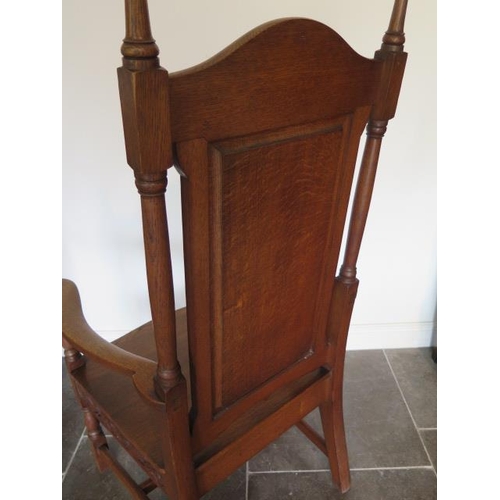 80 - A well carved oak throne armchair, 135cm tall x 73cm wide x 62cm deep