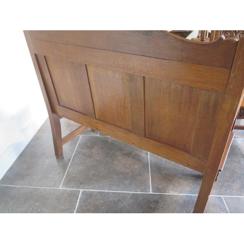 81 - A well carved oak bench hall settle, dated 1928, 106cm tall x 113cm x 55cm, in good condition with a... 