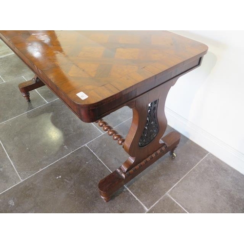 82 - A 19th century rosewood and burr walnut stretcher table on lyre end supports united by a barley twis... 