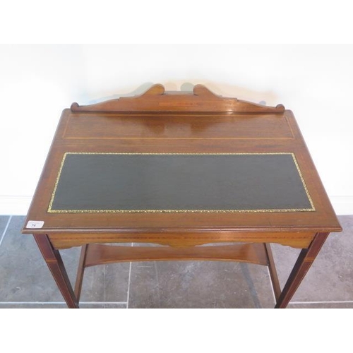 85 - A nice Edwardian writing desk with boxwood and stringing inlay, tapered legs with brass castors, lea... 