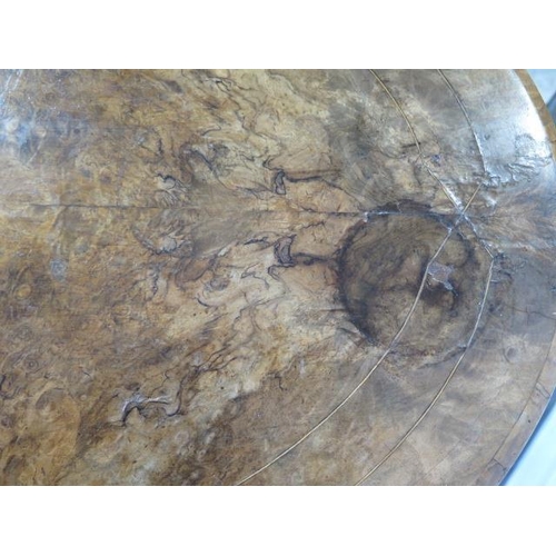 90 - A Victorian inlaid burr walnut oval centre table on carved supports united by a turned stretcher, 71... 