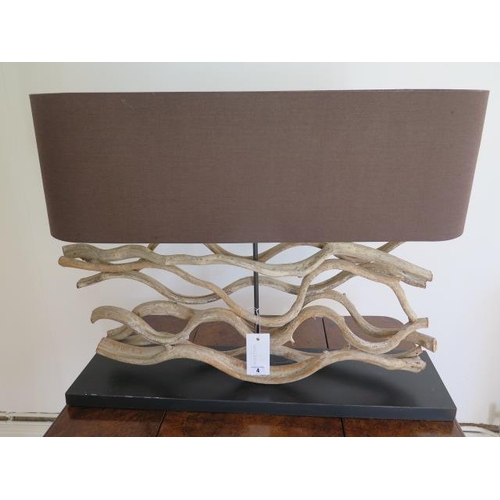 A driftwood table lamp, 63cm tall x 80cm x 20cm, in working order