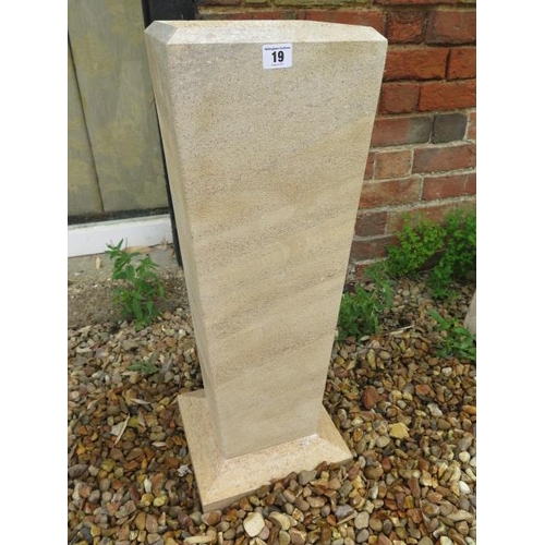 19 - A hand carved contemporary styled bird bath made from local limestone, 73cm tall