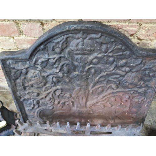 74 - A cast iron fireback and grate with a mahogany coal scuttle and fire iron set, back 75cm x 85cm, gra... 