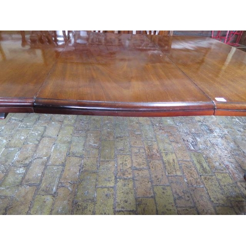 83 - A 19th century mahogany pullout dining table with two leaves on turned carved legs, 71cm tall x 126c... 