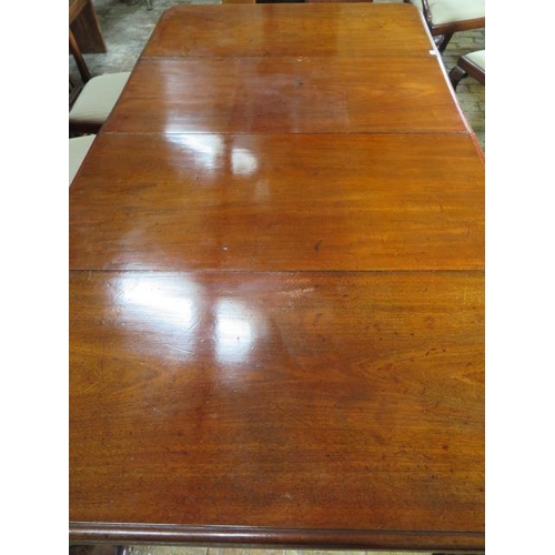 83 - A 19th century mahogany pullout dining table with two leaves on turned carved legs, 71cm tall x 126c... 