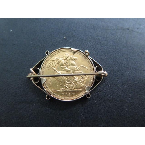 865 - A Victorian gold full sovereign dated 1888 in a hallmarked 9ct brooch mount, approx 10.5 grams