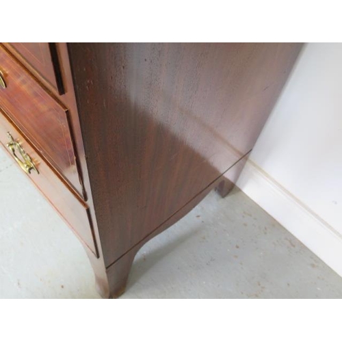 87 - A Georgian mahogany linen press with two door top enclosing a slide and a shelf above a four drawer ... 