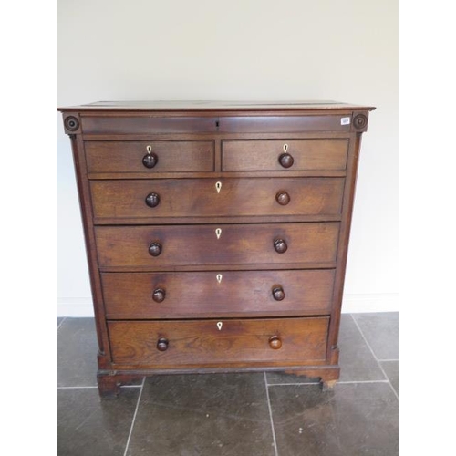 89 - A Georgian oak and mahogany six drawer chest with an additional secret top drawer, some losses mainl... 