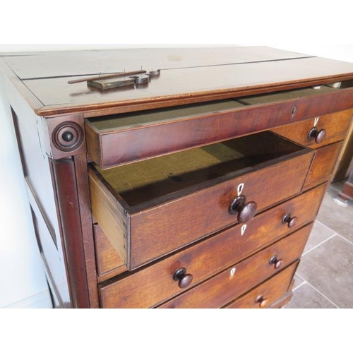 89 - A Georgian oak and mahogany six drawer chest with an additional secret top drawer, some losses mainl... 