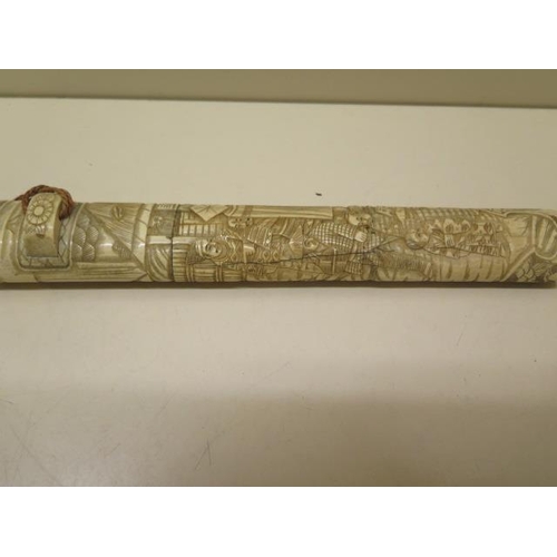 944 - A 20th century carved bone Japanese dagger, 39cm long, generally good ,roundal missing to one end, c... 