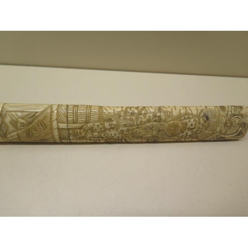 944 - A 20th century carved bone Japanese dagger, 39cm long, generally good ,roundal missing to one end, c... 