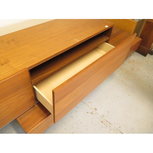 3 - A teak effect four drawer sideboard TV unit adjustable in length, 71cm tall x 61cm deep