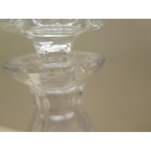 304 - A pair of good quality cut glass decanters, 25cm tall, one has a small chip to rim and small chips t... 