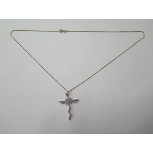 A 9ct white gold diamond cross 0.40ct, 4.3cm long, on a 9ct yellow gold 52cm long chain, total weight approx 5.2 grams, in good condition (ref 7211)