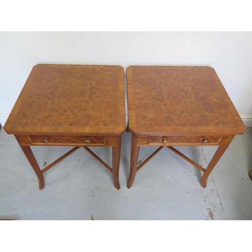 89 - A pair of burr wood veneer lamp tables each with a drawer on splayed legs united by cross stretchers... 