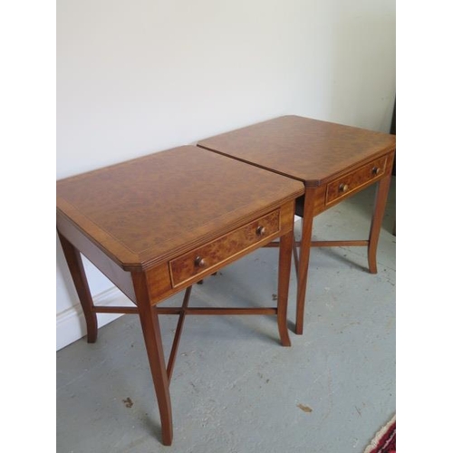 89 - A pair of burr wood veneer lamp tables each with a drawer on splayed legs united by cross stretchers... 