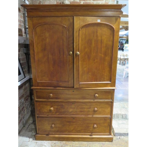 91 - A Victorian walnut linen press with a two door top enclosing three linen slides above three long dra... 