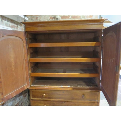 91 - A Victorian walnut linen press with a two door top enclosing three linen slides above three long dra... 