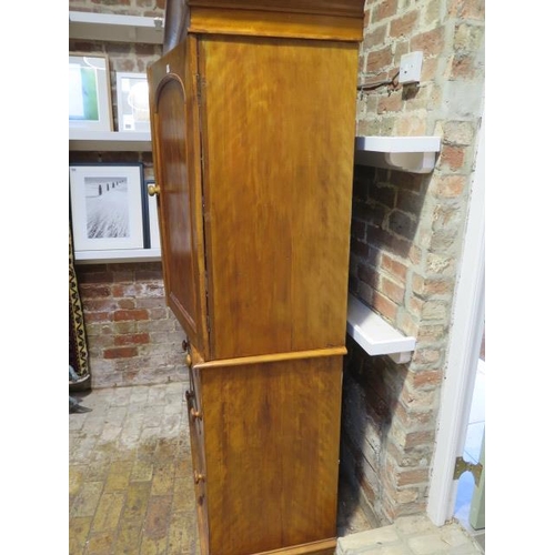 91 - A Victorian walnut linen press with a two door top enclosing three linen slides above three long dra... 