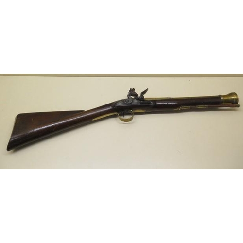 940 - A flintlock canon barrelled blunderbuss, the lock signed Cox, barrel length 38cm, total length 79cm,... 