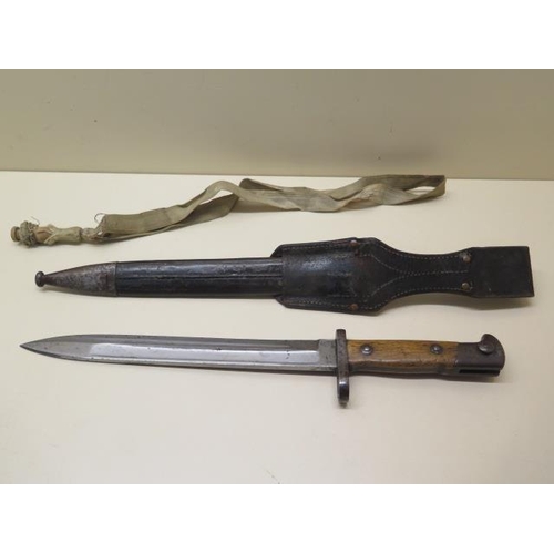 942 - A German knife bayonet with scabbard and Troddel, the blade marked Weyersberg Kirschbaum & Co Solige... 