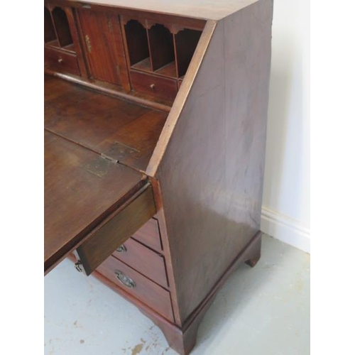 60 - A Georgian mahogany four drawer bureau of small proportions with a fitted interior, 95cm tall x 86cm... 